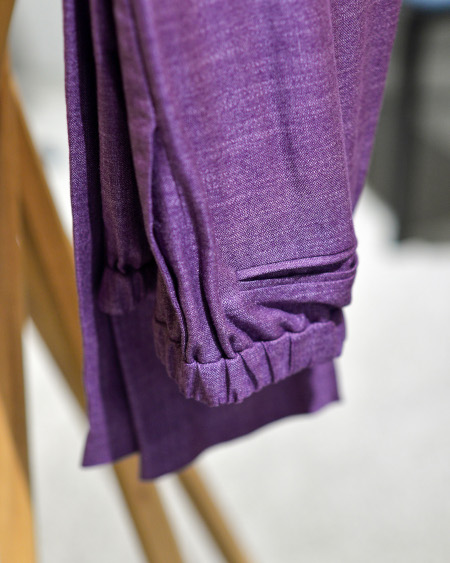 Detail of the waist and pockets on purple bamboo trousers
