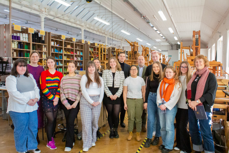 Group shot in the weave workshop at Heriot-Watt University School of Textiles and Design